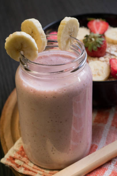 Banana, strawberry and oatmeal smoothie stock photo