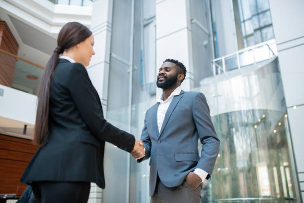 istock Congratulating colleague with successful contract 1203895042
