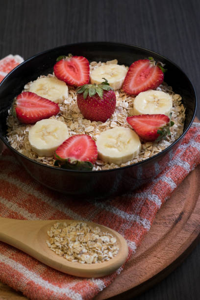 Bowl with strawberry and banana oatmeal stock photo