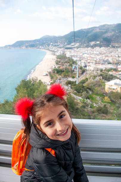 istock Turkish cute little girl posing in the cable car 1203897621