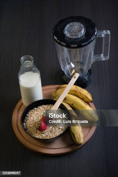 Strawberries Oatmeal And Bananas With A Bottle Of Milk Stock Photo - Download Image Now