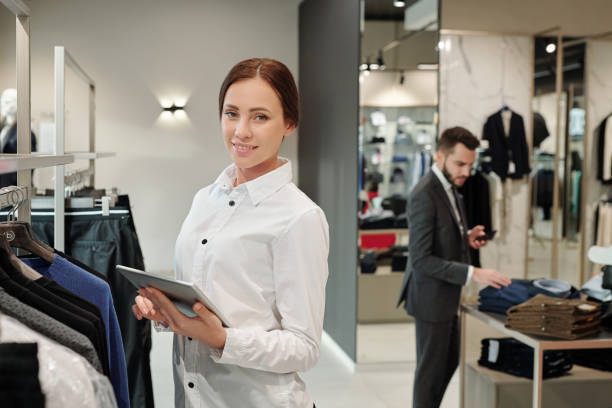 istock Checking receiving merchandise in clothes shop 1203900093