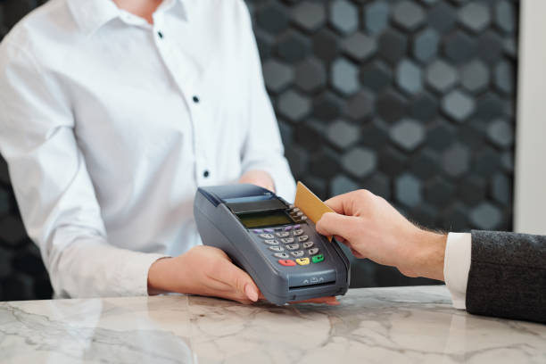 istock Swiping credit card in store 1203900146