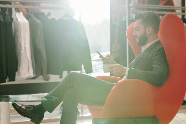 istock Customer service in clothing shop 1203900244