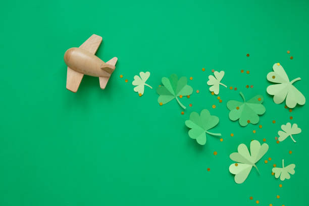 istock St. Patrick's day, Plane luck Shamrock on a green background 1203900284