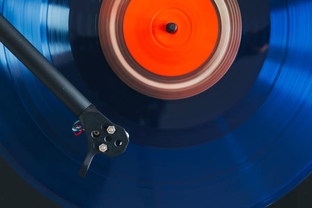 istock Close up of blue vinyl record playing 1203903523