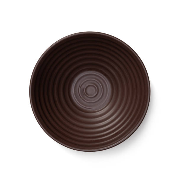 Empty blank brown ceramic round bowl isolated on white background with shadow, Flat lay of traditional handcrafted kitchenware concept