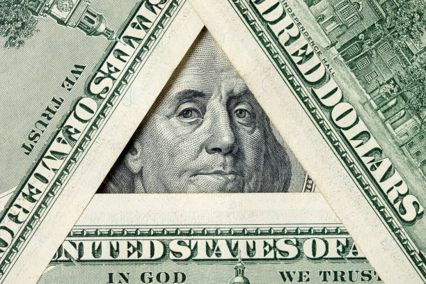 istock Triangle made of $100 bills with Benjamin Franklin inside 1203905577