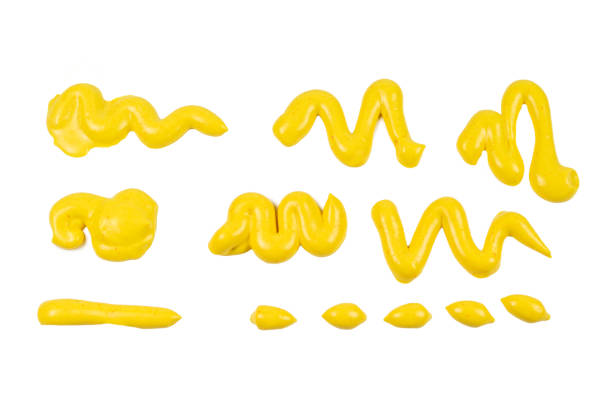 istock Yellow cheese sauce splashes isolated on white background. 1203906977
