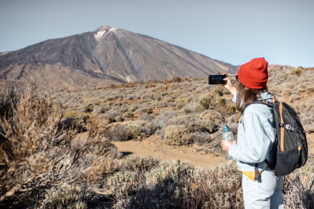 istock Woman traveling on volcano valley 1203908587
