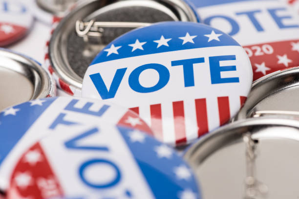 istock Vote election badge button for 2020 background, vote USA 2020 1203908643