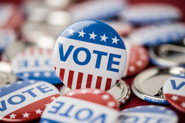 istock Vote election badge button for 2020 background, vote USA 2020 1203909060
