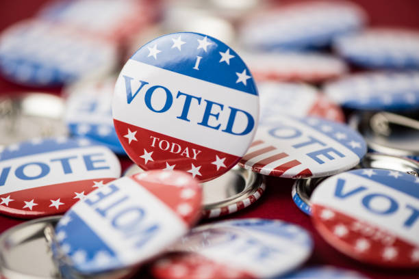 istock Vote election badge button for 2020 background, vote USA 2020 1203909076