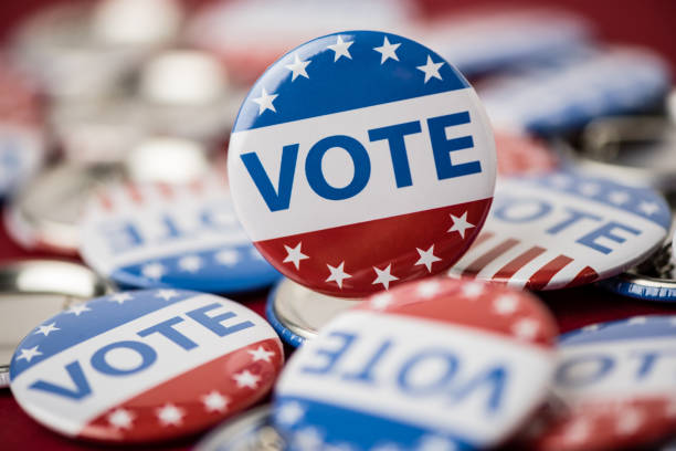 istock Vote election badge button for 2020 background, vote USA 2020 1203909095