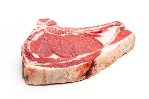 Three veal steaks isolated on a white background