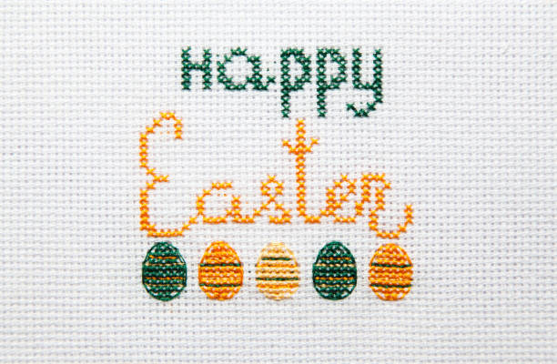 istock The inscription Happy Easter is embroidered on white cloth. 1203911295