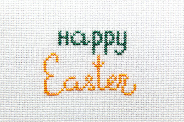 istock The inscription Happy Easter is embroidered on white cloth. 1203911307