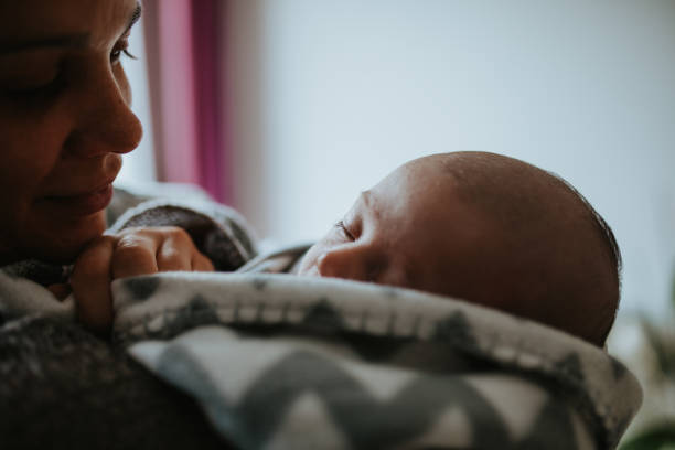 istock Smiling Mother Looking At Baby Boy 1203911365
