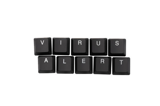 istock Word virus alert written on keyboard. Isolated on white. 1203911680