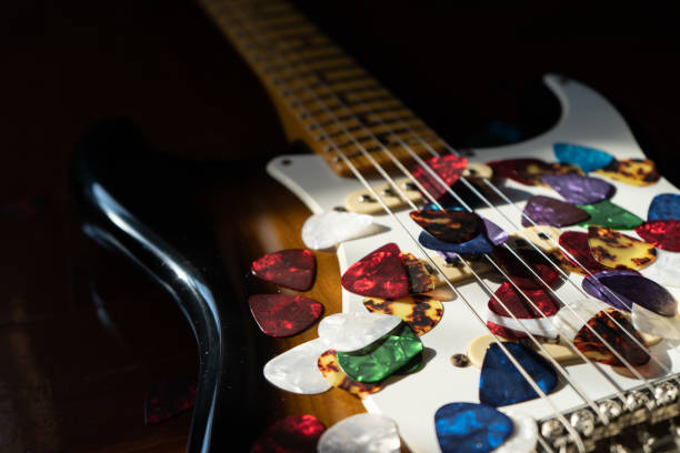 istock Guitar picks on electric guitar 1203911709