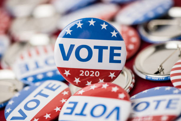 istock Vote election badge button for 2020 background, vote USA 2020 1203912220