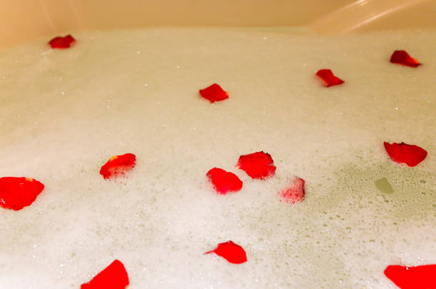 istock Rose petals are romantic in the bathtub. 1203914795