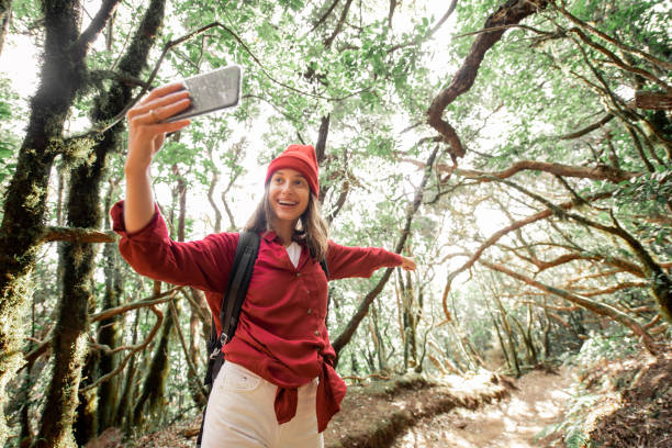 istock Woman traveling in the rainforest 1203916009