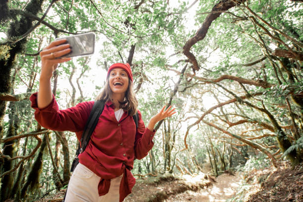 istock Woman traveling in the rainforest 1203916209