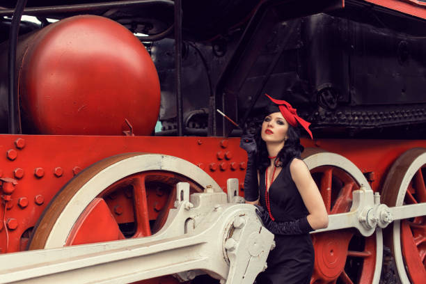 istock Young girl at the retro train station 1203916961