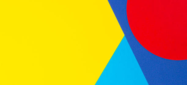 istock Abstract geometric shape yelllow, blue, red color paper background 1203918755