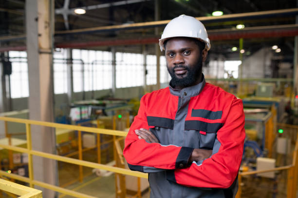 istock Afro-American factory worker in hardhat 1203919636