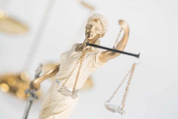 istock Statue of Themis on a white background, justice 1203919986
