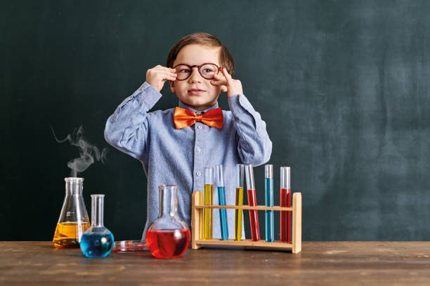 istock Cute child scientist learning science at classroom with chemistry tools. Education is science. 1203921231