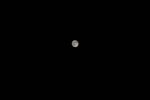 istock Full moon on a black sky at night 1203921294