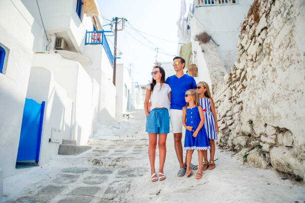 istock Family having fun outdoors on Mykonos streets 1203921528