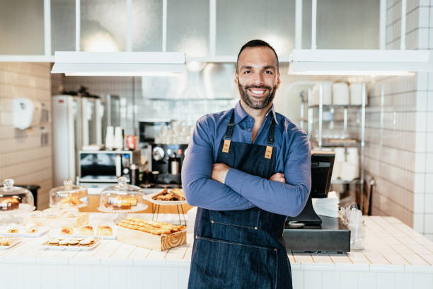 istock Determined Latino man running small business - bakery and cafe 1203922773