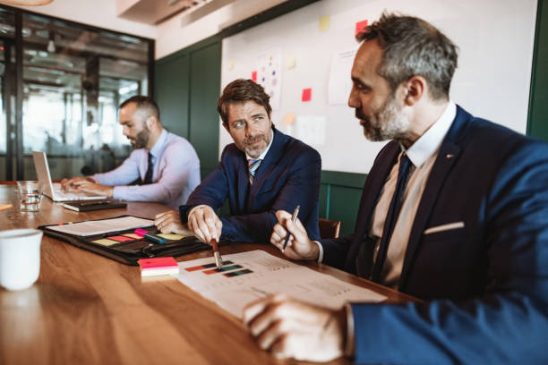 istock Mature Latino businessmen developing marketing strategy 1203924071