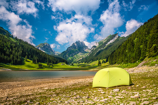 Small camping tent in beautiful mountain landscape - Switzerland