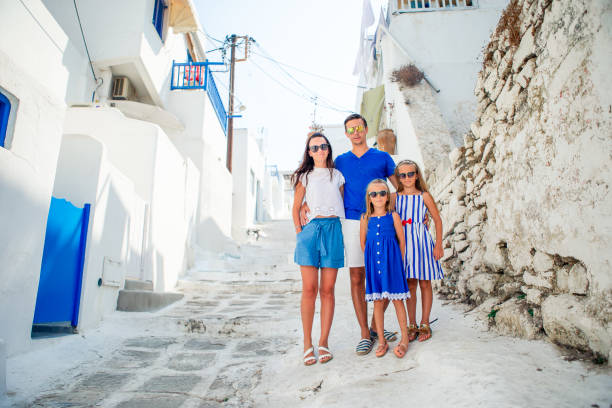 istock Family having fun outdoors on Mykonos streets 1203925664