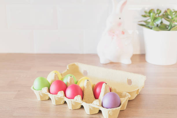 istock Easter Eggs In Cardboard, Carton, Rabbit, Succulent On The Kitchen Counter, Close Up. Kitchenware In Modern Kitchen Interior. White Tiles Background 1203926192