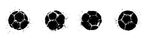 grunge piłka nożna drukuje z plamami - soccer mud soccer ball ball stock illustrations