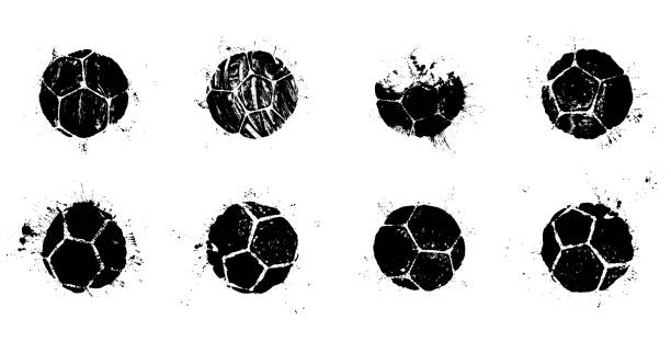 Grunge soccer ball abstract silhouettes set Grunge soccer balls set. Vector illustration of real soccer ball prints with splashes for your football poster, flyer or banner design sports ball stock illustrations
