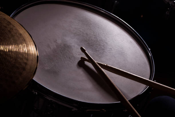 istock Closeup of drumsticks lying on the drum set 1203928430