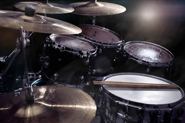 istock Closeup of drumsticks lying on the drum set 1203928721