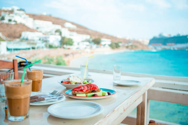istock Healthy breakfast in outdoor cafe with sea view 1203929355