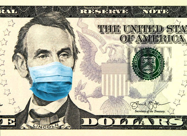 Coronavirus Wuhan Sars illness. Concept for quarantine in the United States. 5 dollar banknote where Lincoln wears a face mask. Digital montage. stock photo