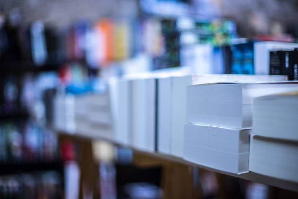 istock Stack of books at a charity book flea market, text space 1203931351