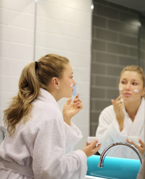 istock Magic anti-aging cream.Applying the cream 1203932455