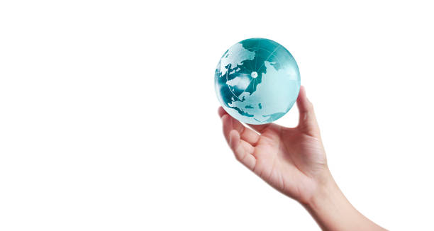 istock Globe ,earth in human hand, holding our planet glowing 1203932971