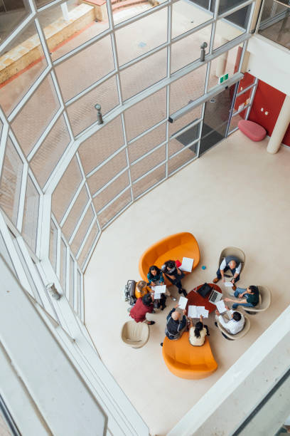 istock Birds Eye View of Meeting at Work 1203934236